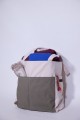 The large tote bag holding a meditation bench, zabuton, shawl and rudraksha mala
